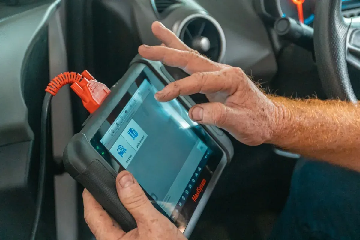 Illustrative stock photograph: Handheld vehicle diagnostic scanner
