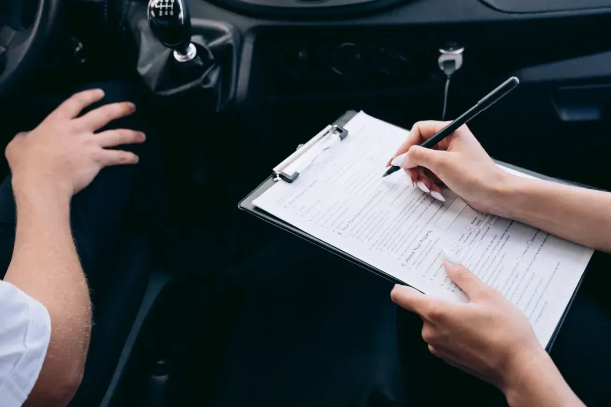 Illustrative stock photograph: Vehicle paperwork on a clipboard